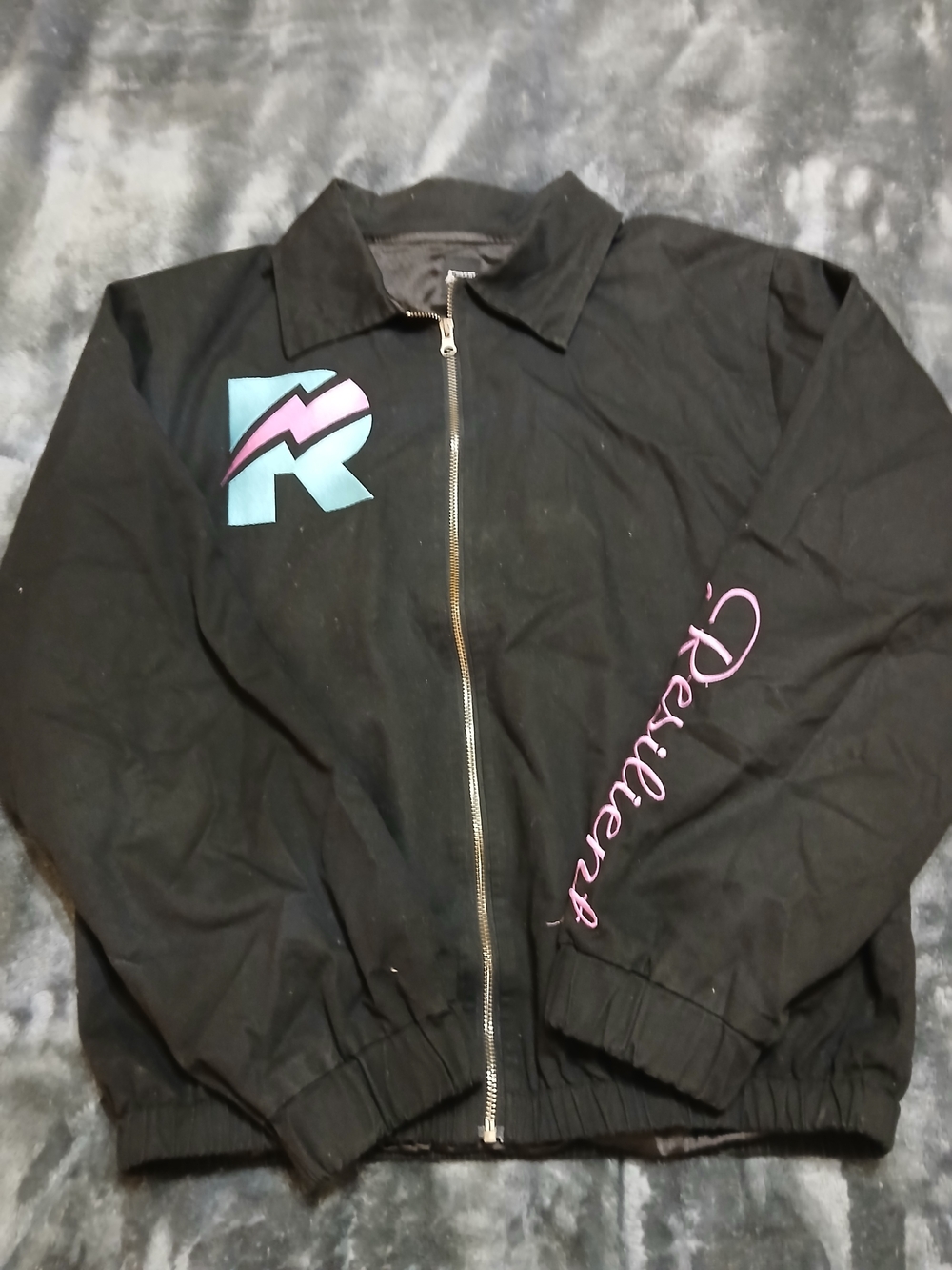 Black Bomber Jacket with Pink Script and Teal Accent
